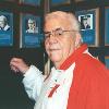 Duva poses by his plaque on the Hall of Fame Wall