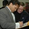 Vinny Paz signs an autograph for a fan