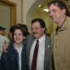 Billy Backus poses for a photo with a pair of boxing fans