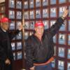 Torres and Ortiz point to their plaques on the HOF Wall