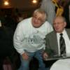 Basilio poses for a photo with a fan