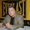 George Chuvalo signs autographs for his fans