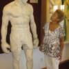 Lathan examines the statue entitled "Undaunted," which won many awards at the 1939 World's Fair.