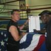Antuofermo and Griffith point to the display detailing how many times legendary fighters boxed in the MSG ring. Antuofermo fought in the ring 15 times and Griffith 28 times.