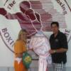 Christy Martin presents her robe and trunks to Hall director Ed Brophy the day after her Sept. 2nd title-winning bout in Syracuse.