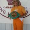 And new champion! Christy Martin proudly holds her WBC junior middleweight title belt.