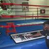 Griffith points to an image of him boxing fellow Hall of Famer Dick Tiger at Madison Square Garden.