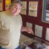 Canada's George Chuvalo points to the gloves he wore in his bout with Doug Jones at Madison Square Garden in 1964.