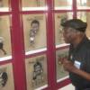 Hall of Famer Emile Griffith checks out his likeness on the exhibit of outstanding middleweights. 