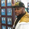 Mustafa Muhammad points to Matthew Saad Muhammad's plaque on the HOF Wall