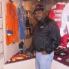 Spinks points to his fight-worn boxing robe on display in Canastota.