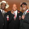 Michael Spinks, "Bonecrusher" Smith and Leon Spinks gather for a photo at 2013 Hall of Fame Weekend.