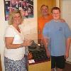 Jennifer Frawley, her husband Joe and son Will pose by Bert Sugar's typewriter exhibit.