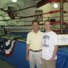 Michael Conn (left), son of Billy Conn, and his son Will (right) pose by the MSG ring that Billy Conn boxed in nine times.