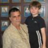 Scott Fitzsimmons, great great grandson of Bob Fitszimmons,  proudly poses by Fitzsimmons’ plaque on the Hall of Fame Wall with his son David.