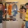 (left to right) Alex Torres and Ileana and Norberto Medina point to Pipino Cuevas' robe